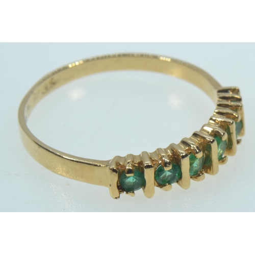 63 - 14ct gold & emerald half hoop ring, size Q, 2.56 grams