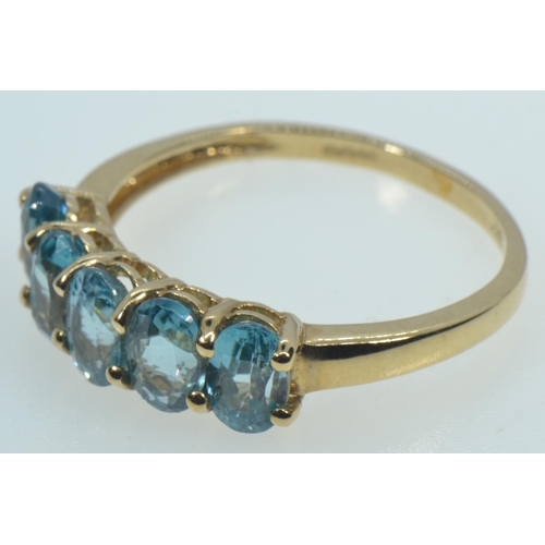 65 - 9ct gold & blue zircon five stone ring, size R1/2, 2.7 grams