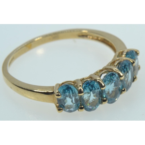 65 - 9ct gold & blue zircon five stone ring, size R1/2, 2.7 grams