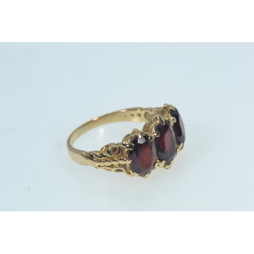 78 - 9ct gold & garnet trilogy ring, size K, 3.52 grams