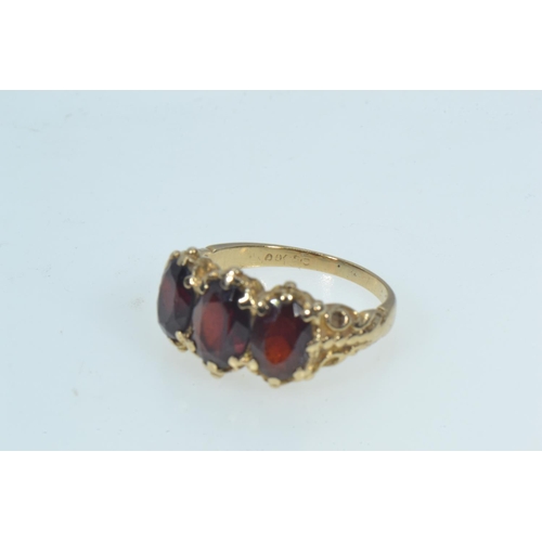 78 - 9ct gold & garnet trilogy ring, size K, 3.52 grams