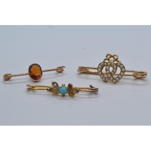 87 - Three yellow metal & gem set brooches, comprising a seed pearl set sweetheart brooch & two o... 