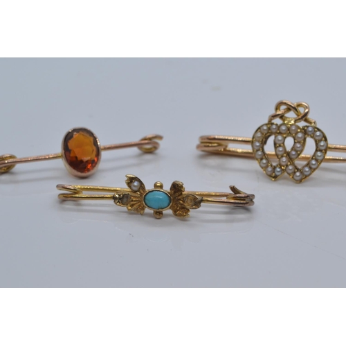 87 - Three yellow metal & gem set brooches, comprising a seed pearl set sweetheart brooch & two o... 