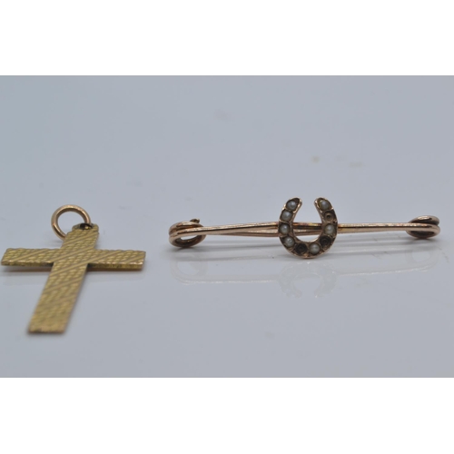 88 - 9ct gold textured cross pendant and a yellow metal & seed pearl brooch, marks worn, yellow metal... 