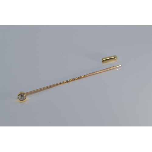 91 - Yellow metal & diamond stick pin, tests positive for 18ct gold, 1.3 grams