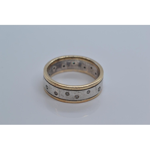 92 - 9ct gold & 925 silver band with small flush set diamonds. 5g gross weight. Size M/N