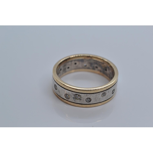 92 - 9ct gold & 925 silver band with small flush set diamonds. 5g gross weight. Size M/N