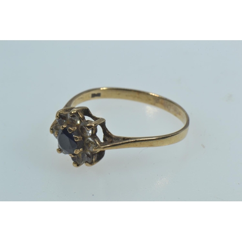 125 - 9ct gold, sapphire & white stone flowerhead cluster ring, size P1/2, 1.68 grams