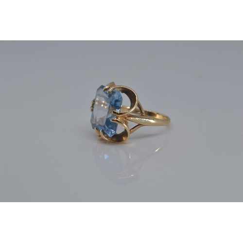 134 - 9ct gold ring set with large blue (stone 12mm x 15 mm), size O, gross weight 5.5 grams