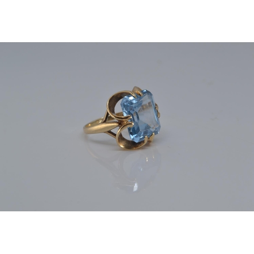 134 - 9ct gold ring set with large blue (stone 12mm x 15 mm), size O, gross weight 5.5 grams