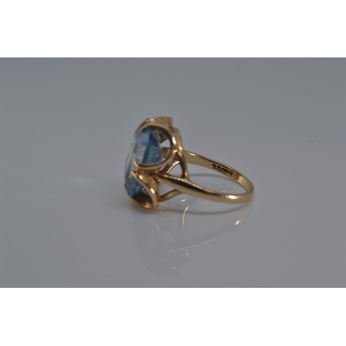 134 - 9ct gold ring set with large blue (stone 12mm x 15 mm), size O, gross weight 5.5 grams