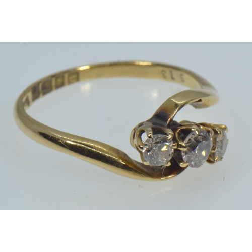 135 - 18ct gold & three stone diamond ring, size M, 2.49 grams