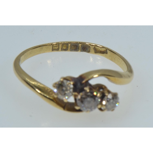 135 - 18ct gold & three stone diamond ring, size M, 2.49 grams