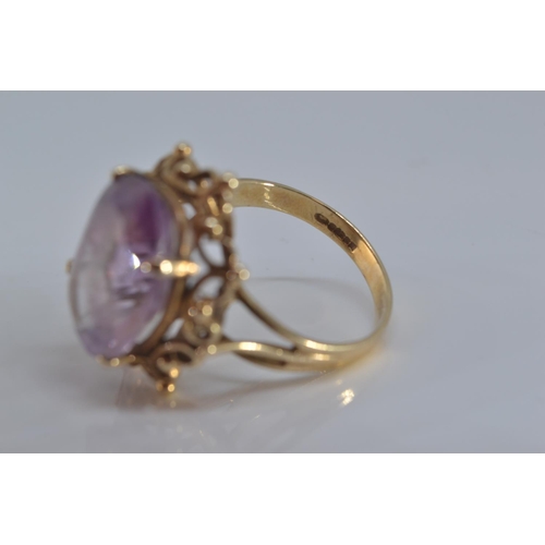 137 - 9ct gold ring set with single oval amethyst stone 15mm x 12mm, size O/P gross, weight 5.2 grams