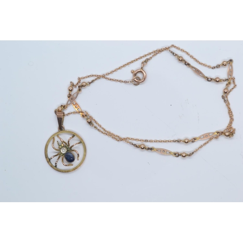 140 - 9ct gold, blue sapphire & white sapphire spider pendant and a yellow metal fancy link neck chain... 