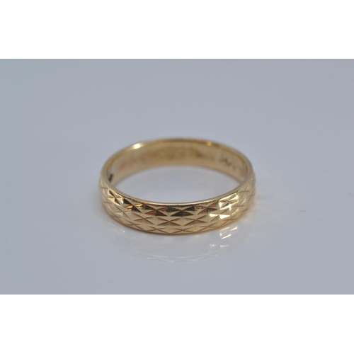 144 - 9ct gold band ring, with etched design, size N, 2.5 grams