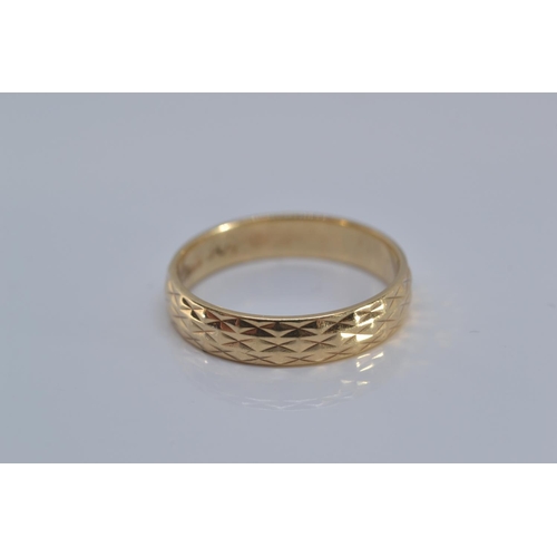 144 - 9ct gold band ring, with etched design, size N, 2.5 grams