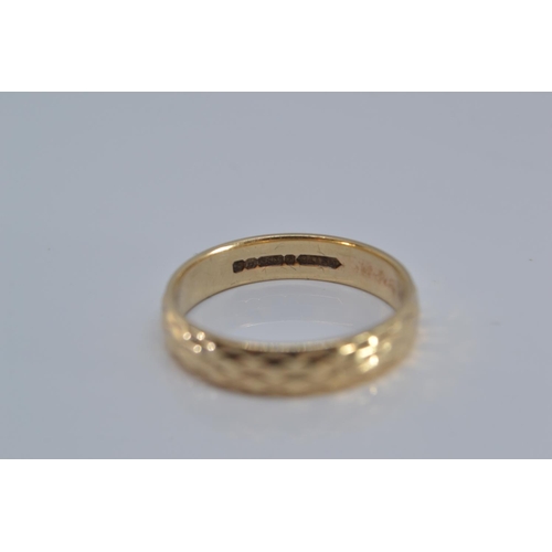 144 - 9ct gold band ring, with etched design, size N, 2.5 grams