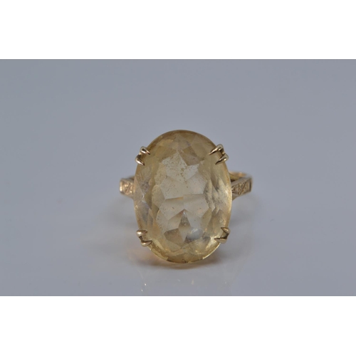 166 - 9ct gold ring claw set with pale citrine coloured stone, size O/P, gross weight 5.5 grams