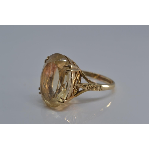 166 - 9ct gold ring claw set with pale citrine coloured stone, size O/P, gross weight 5.5 grams