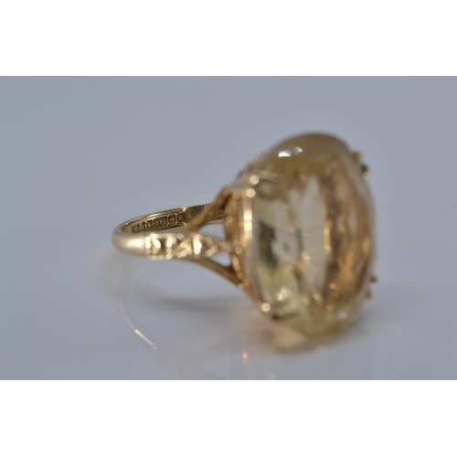 166 - 9ct gold ring claw set with pale citrine coloured stone, size O/P, gross weight 5.5 grams