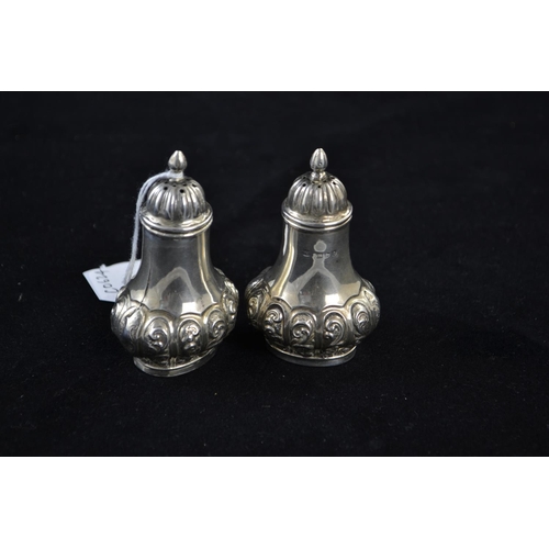 176 - Pair of late Victorian silver pepperettes, maker William Aitken, Chester 1899, height 8cm, gross wei... 