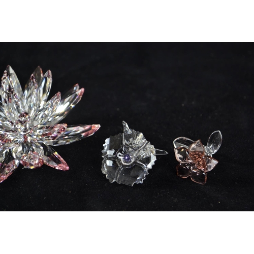 270 - Four Swarovski flowers, including: Lotus Flower, no. 5100663, A9100NR000001; Desert Rose gist, no. 5... 