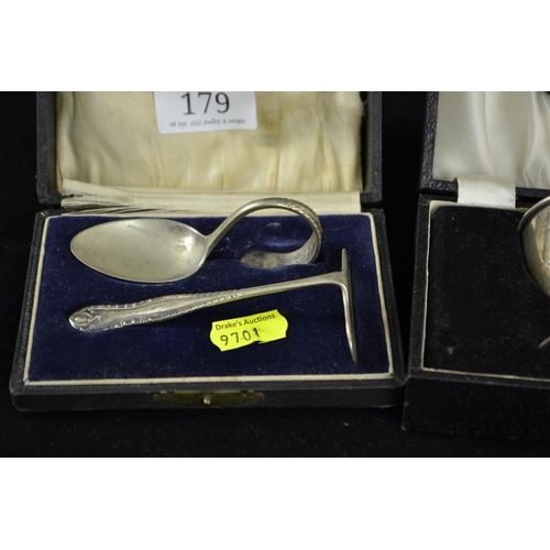 179 - Three boxed silver christening sets, various makers & dates, including a napkin ring with initia... 