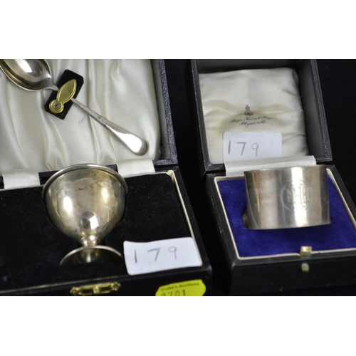 179 - Three boxed silver christening sets, various makers & dates, including a napkin ring with initia... 