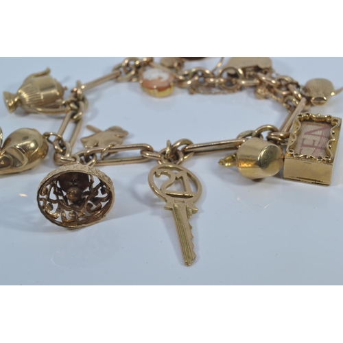 49 - 9ct gold charm bracelet with heart-shaped padlock clasp, suspending twelve 9ct gold charms, each lin... 