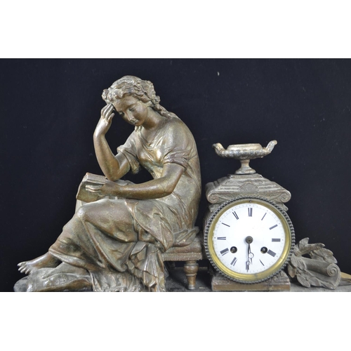 355 - Slate mantle clock with a figure of a seated lady, with key. width 48 cms, ht 39 cms, clock face dia... 