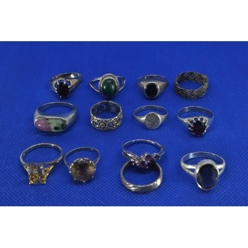 223 - Twelve silver rings, some stone set, two unmarked, gross weight 45.3 grams