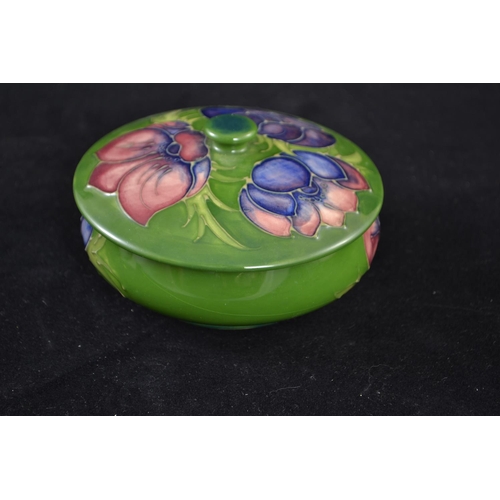 430 - Moorcroft green bowl and cover in 'Anemone' design, lid dia. 13cm