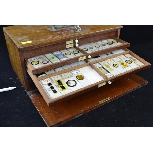 388 - C19th lockable wooden microscope slide case with sunken brass handle, brass fittings and ten drawers... 