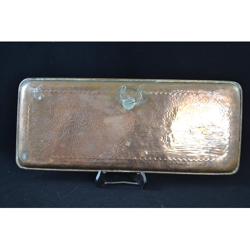 392 - A Newlyn copper rectangular tray with planished and chased detail depicting St Michael's Mount and a... 