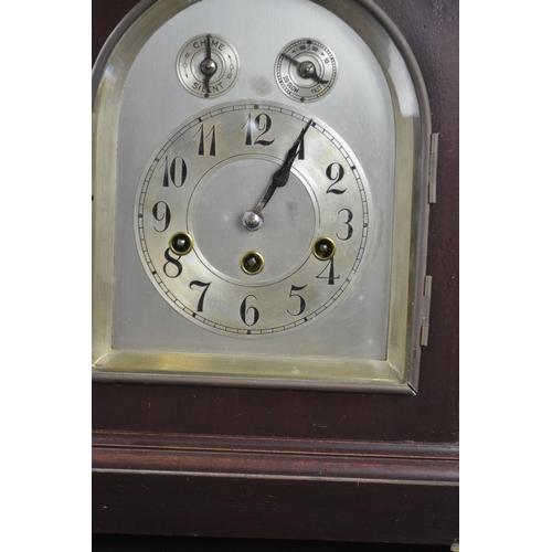 398 - Mahogany cased chiming mantle clock with key & pendulum. Ht 38cms