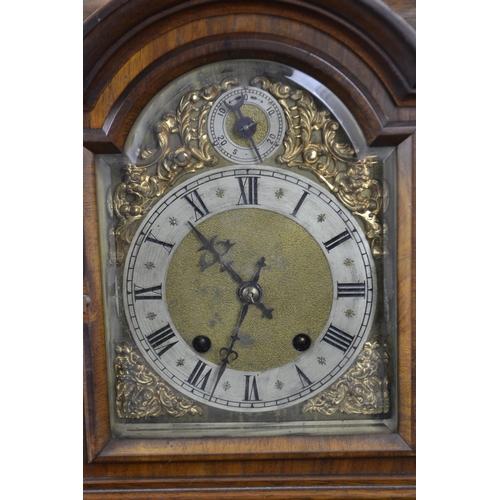 399 - Ornate mantle clock with 2 dials ,gilt decoration around the face, with key and pendulum. Ht 48.5cms