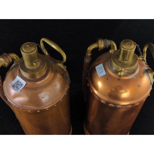 373 - Two copper and brass antique fire extinguishers, one stamped RJ 39198, height 49cm