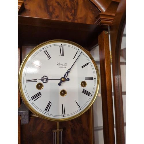 444 - Wood cased wallclock by Comitti, London; with glazed front & sides, pendulum & key present