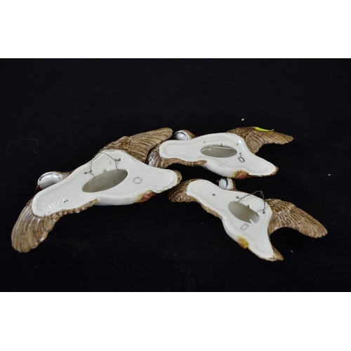 348 - Three graduated Beswick flying partridges, model 1188, printed and impressed marks, largest with a w... 