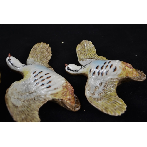 348 - Three graduated Beswick flying partridges, model 1188, printed and impressed marks, largest with a w... 