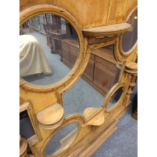 455 - Large stripped pine C19th overmantel unit with 4 circular mirrors and 1 shaped central mirror