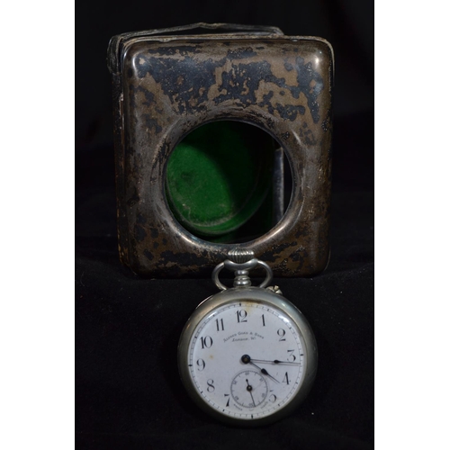 221 - Silver fronted watch stand, hallmarks rubbed, 8.5cm high, enclosing an open faced pocket watch with ... 