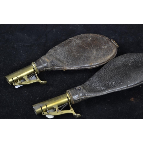 329 - Two antique leather and brass shot powder flasks