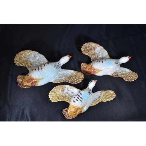 348 - Three graduated Beswick flying partridges, model 1188, printed and impressed marks, largest with a w... 