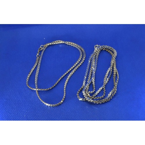 238 - Two silver neck chains, measuring 84cm and 50cm respectively, gross weight 38.8 grams