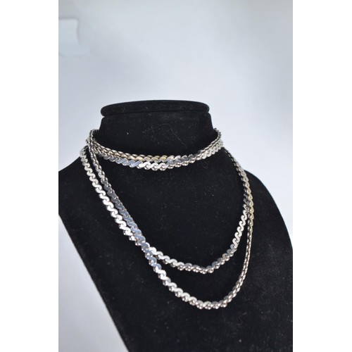 238 - Two silver neck chains, measuring 84cm and 50cm respectively, gross weight 38.8 grams