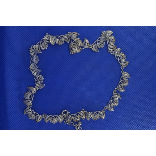 239 - Silver necklace with filigree leaf decoration, marked 'Sterling Foreign', length 460mm, adjustable, ... 