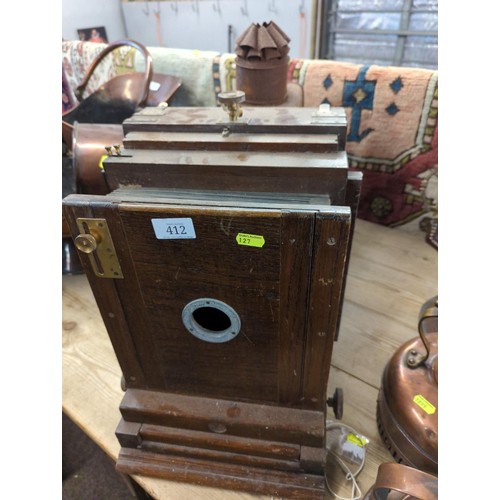 412 - Magic Lantern with wooden casing, leather bellows. Metal housing where lighting is powered with para... 