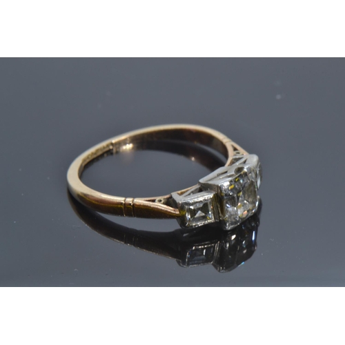 72A - 18ct gold, platinum & emerald-cut diamond trilogy ring, the centre stone weighing approximately ... 